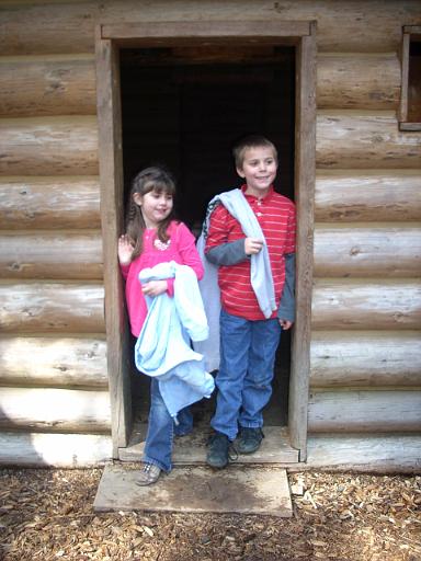 Oregon coast 013.jpg - A and G seemed to enjoy exploring the replica of the 50' x 50' fort where the Lewis and Clark expedition spent the winter of 1805-1806.